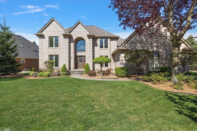 53633 Cherrywood Dr, Shelby Twp, MI 48315 - view of front of home with brick siding and a front yard