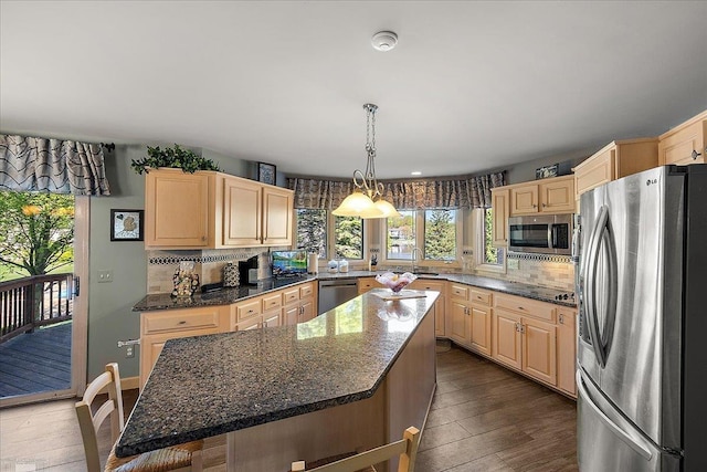 53633 Cherrywood Dr, Shelby Twp, MI 48315 - kitchen with appliances with stainless steel finishes, light brown cabinets, a center island, tasteful backsplash, and dark wood-style flooring