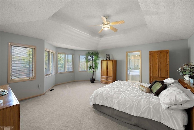 53633 Cherrywood Dr, Shelby Twp, MI 48315 - bedroom featuring light carpet, baseboards, a textured ceiling, a raised ceiling, and ensuite bathroom