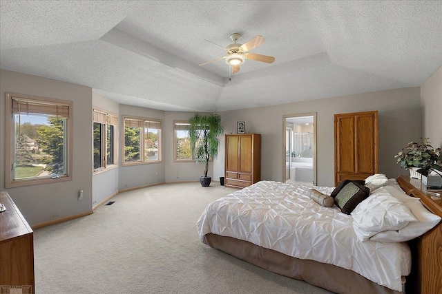 53633 Cherrywood Dr, Shelby Twp, MI 48315 - bedroom with light carpet, baseboards, a raised ceiling, a textured ceiling, and connected bathroom