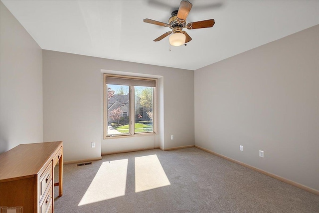 53633 Cherrywood Dr, Shelby Twp, MI 48315 - empty room featuring a ceiling fan, light colored carpet, and baseboards