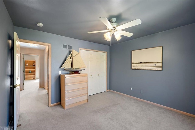 53633 Cherrywood Dr, Shelby Twp, MI 48315 - unfurnished bedroom featuring baseboards, light carpet, a closet, and ceiling fan