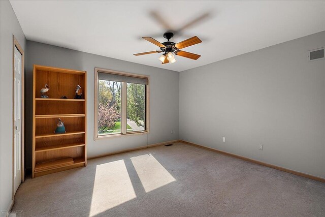 53633 Cherrywood Dr, Shelby Twp, MI 48315 - spare room with carpet flooring, ceiling fan, and baseboards