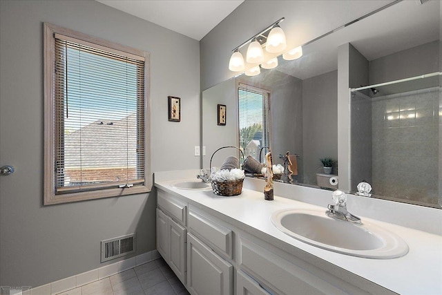 53633 Cherrywood Dr, Shelby Twp, MI 48315 - full bath with tile patterned flooring, double vanity, baseboards, and a shower