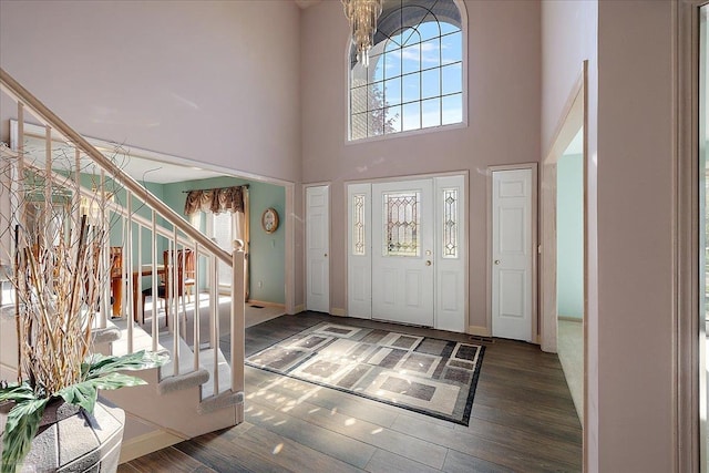 53633 Cherrywood Dr, Shelby Twp, MI 48315 - foyer featuring stairway, wood finished floors, a high ceiling, and baseboards