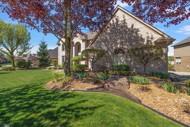 53633 Cherrywood Dr, Shelby Twp, MI 48315 - view of front of home featuring a front yard and brick siding