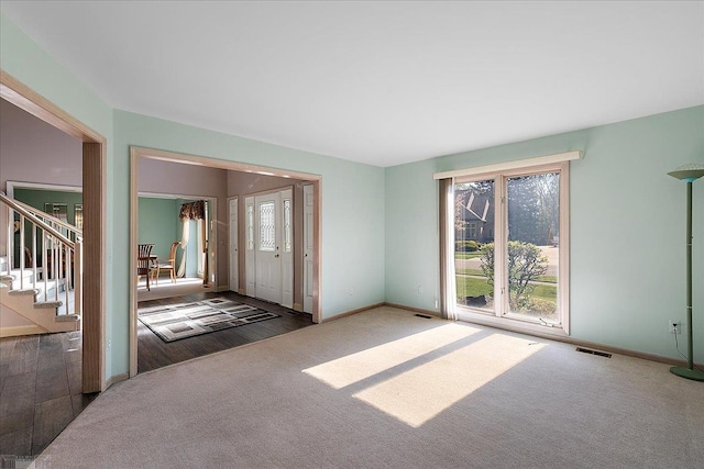 53633 Cherrywood Dr, Shelby Twp, MI 48315 - carpeted entryway featuring baseboards and stairway