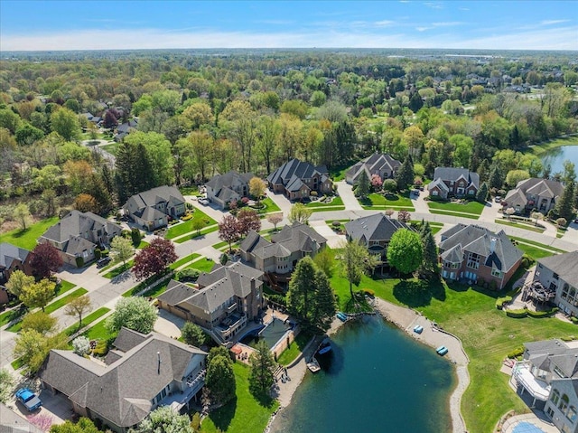 53633 Cherrywood Dr, Shelby Twp, MI 48315 - aerial perspective of suburban area featuring a nearby body of water and a forest