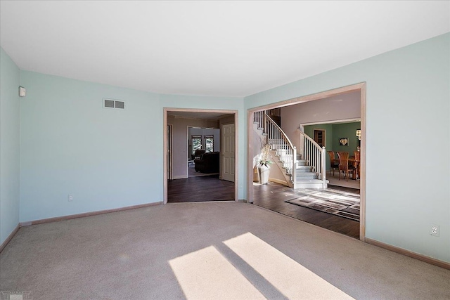 53633 Cherrywood Dr, Shelby Twp, MI 48315 - carpeted empty room with stairway and baseboards