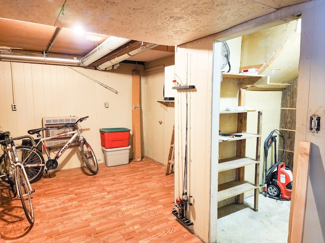 unfinished basement featuring light wood finished floors