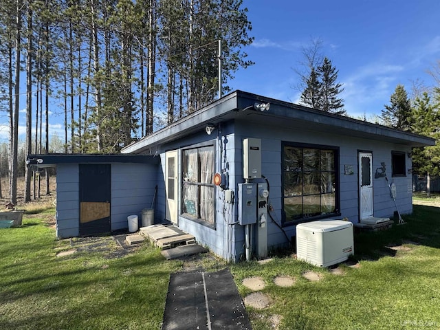 5278 27.5 Rd, Gladstone, MI 49837 - view of home's exterior featuring a yard