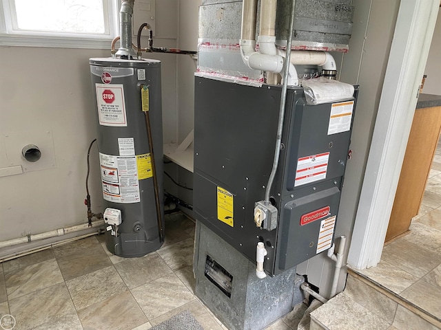 utility room featuring water heater and heating unit