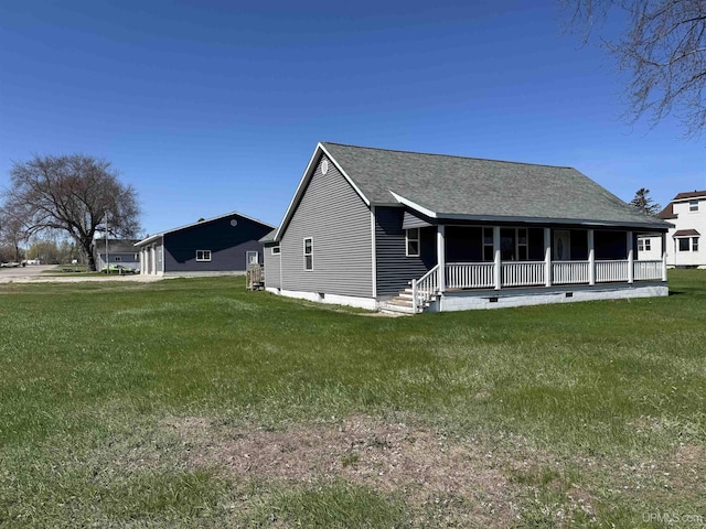 6403 N 1st St, Wells, MI 49894 - rear view of house featuring covered porch, a lawn, roof with shingles, and crawl space