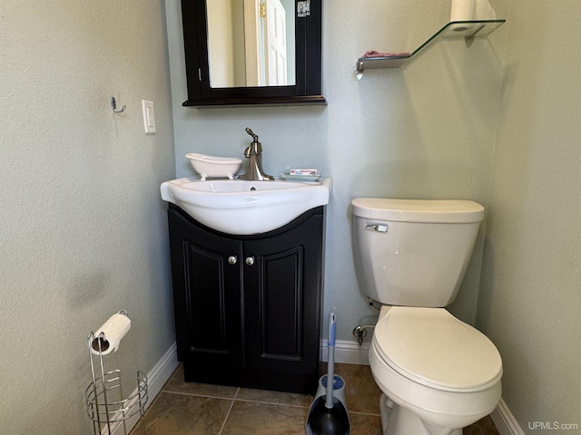 6403 N 1st St, Wells, MI 49894 - bathroom featuring toilet, vanity, and baseboards