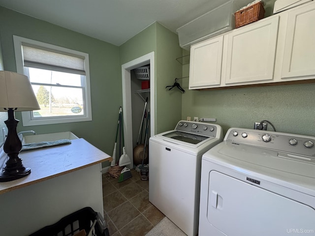 6403 N 1st St, Wells, MI 49894 - washroom with cabinet space, independent washer and dryer, and dark tile patterned floors