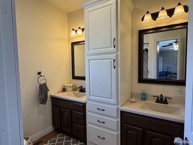6403 N 1st St, Wells, MI 49894 - bathroom with vanity, baseboards, and ceiling fan