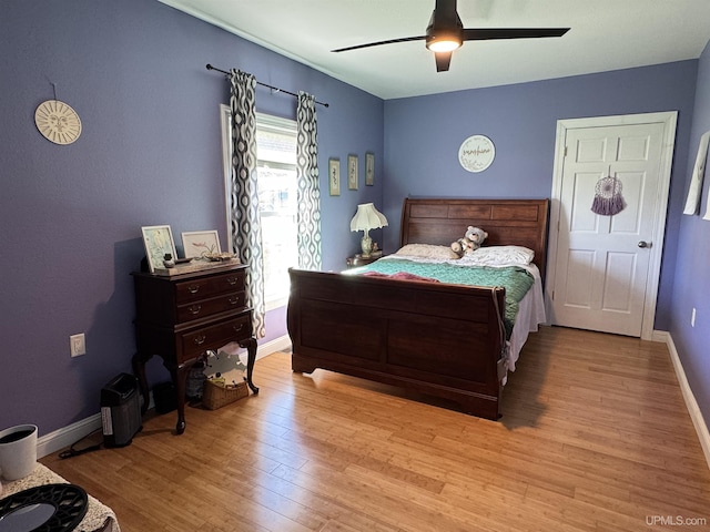 6403 N 1st St, Wells, MI 49894 - bedroom featuring wood finished floors, baseboards, and a ceiling fan