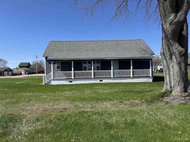 6403 N 1st St, Wells, MI 49894 - back of house with roof with shingles, covered porch, and a yard