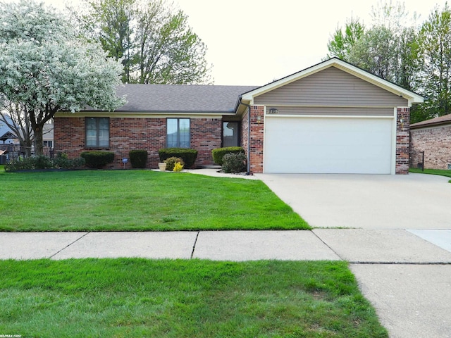 single story home with brick siding, an attached garage, concrete driveway, and a front lawn