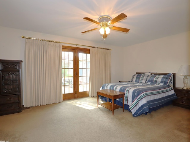 carpeted bedroom featuring access to exterior and ceiling fan