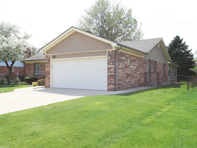 view of home's exterior with a garage, brick siding, concrete driveway, and roof with shingles