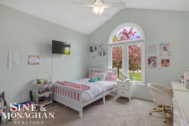 bedroom featuring multiple windows, carpet flooring, high vaulted ceiling, an office area, and a ceiling fan