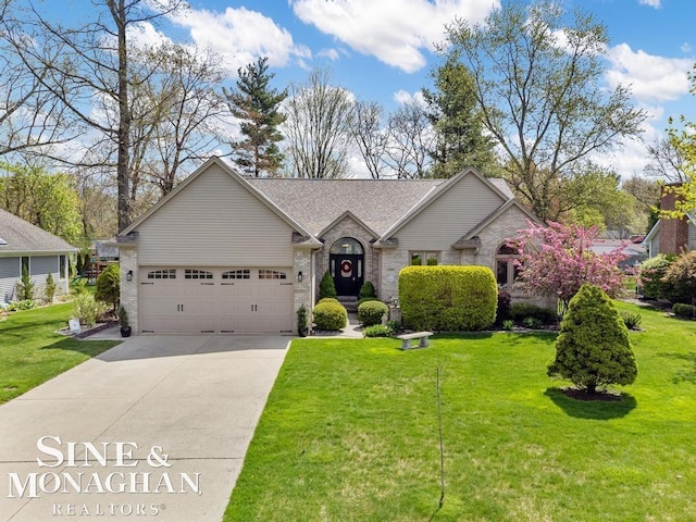 view of front of home featuring driveway, an attached garage, a front yard, and brick siding