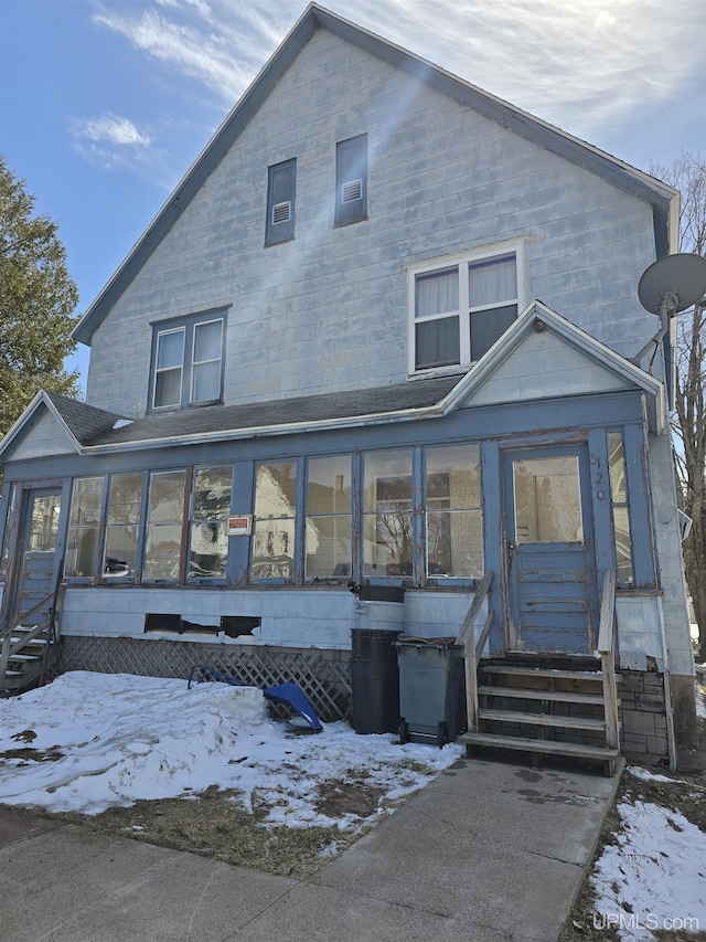 118 S Tamarack St, Laurium, MI 49913 - view of front of house with a sunroom and entry steps