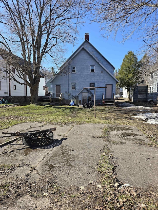 118 S Tamarack St, Laurium, MI 49913 - back of property with a chimney