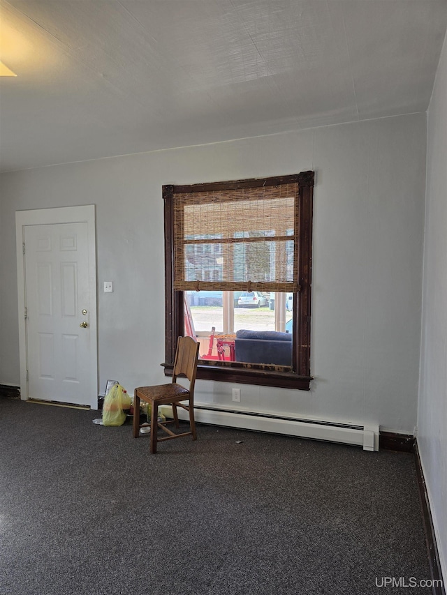 118 S Tamarack St, Laurium, MI 49913 - living area with a baseboard radiator, carpet flooring, and baseboards