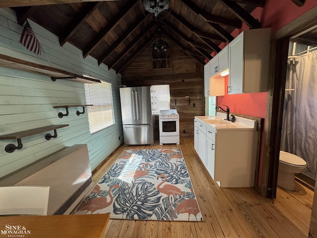 full bathroom featuring wood walls, wooden ceiling, hardwood / wood-style floors, toilet, and vanity