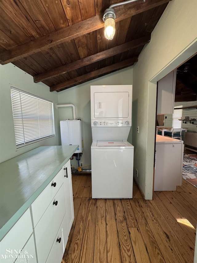 laundry room featuring estacked washer and dryer, wooden ceiling, dark wood-style floors, and water heater