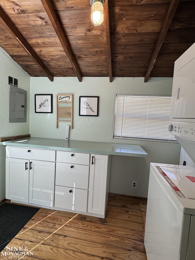 clothes washing area with stacked washer / dryer, wood ceiling, cabinet space, electric panel, and dark wood-type flooring