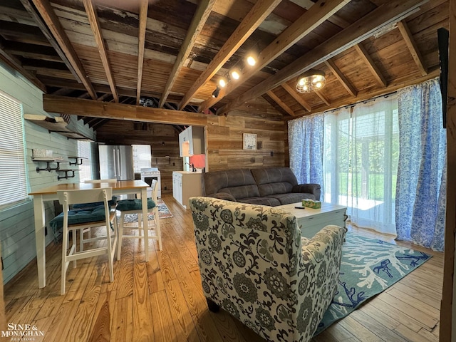 living room featuring wooden walls, light wood-style flooring, and wooden ceiling