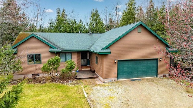 698 E River Dr, Lanse, MI 49946 - rustic home featuring driveway, a front lawn, and an attached garage