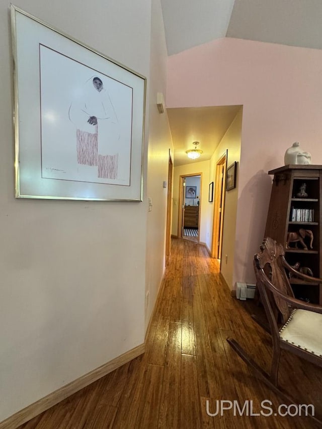 698 E River Dr, Lanse, MI 49946 - hall featuring hardwood / wood-style flooring, baseboards, lofted ceiling, and a baseboard heating unit
