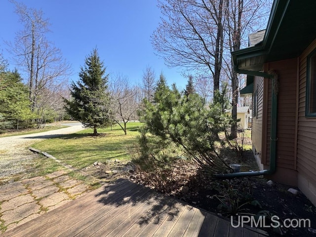 698 E River Dr, Lanse, MI 49946 - view of yard featuring a deck