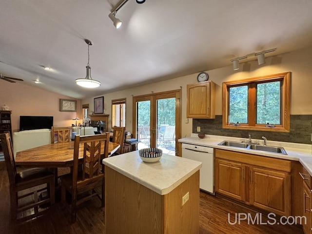 698 E River Dr, Lanse, MI 49946 - kitchen featuring a sink, white dishwasher, light countertops, dark wood-style flooring, and lofted ceiling