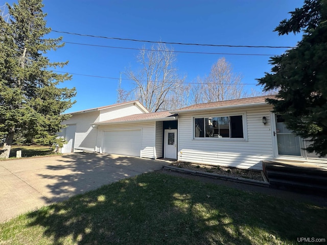 2246 Allen St, Marquette, MI 49855 - view of front of property with a garage and concrete driveway