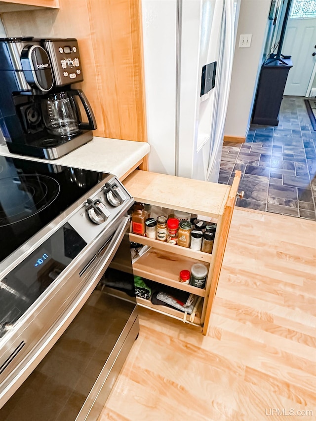 2246 Allen St, Marquette, MI 49855 - kitchen featuring stainless steel range with electric stovetop and light countertops