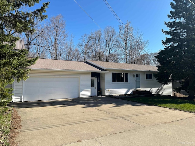 2246 Allen St, Marquette, MI 49855 - single story home featuring concrete driveway and an attached garage