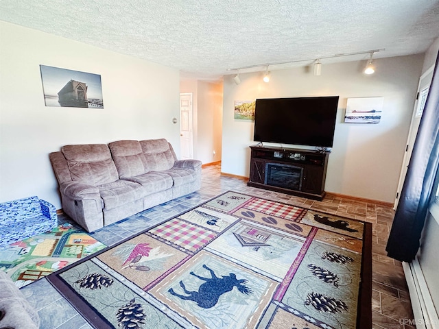 2246 Allen St, Marquette, MI 49855 - living area with track lighting, baseboards, and a textured ceiling