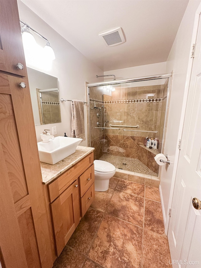 2246 Allen St, Marquette, MI 49855 - full bath featuring a stall shower, vanity, and toilet