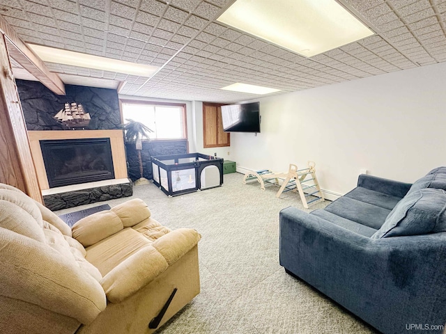 2246 Allen St, Marquette, MI 49855 - living room with carpet, a fireplace, and a baseboard radiator