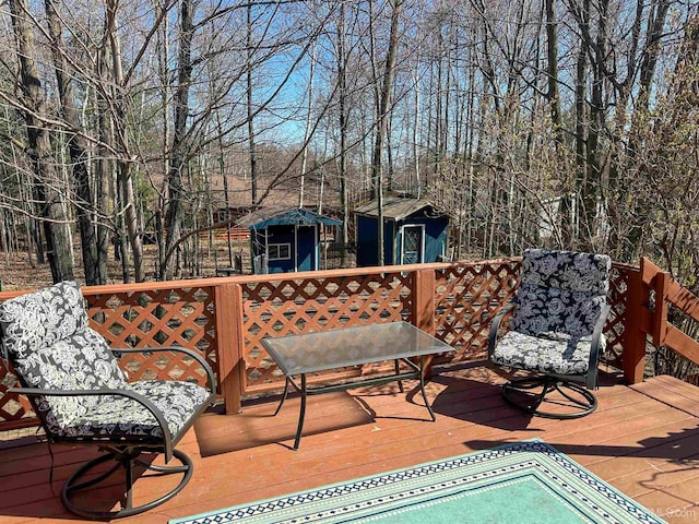 2246 Allen St, Marquette, MI 49855 - wooden deck with an outbuilding and a storage unit