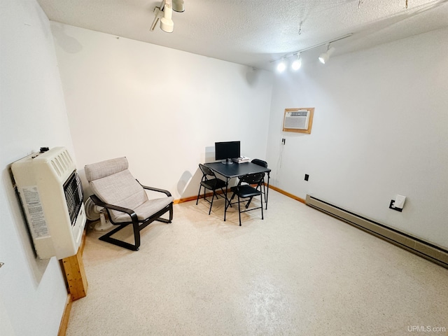2246 Allen St, Marquette, MI 49855 - office featuring rail lighting, baseboard heating, heating unit, a wall mounted AC, and baseboards
