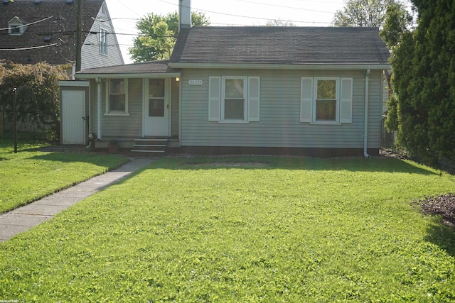 26333 Belanger St, Roseville, MI 48066 - view of front of house featuring a front lawn, a shingled roof, and entry steps
