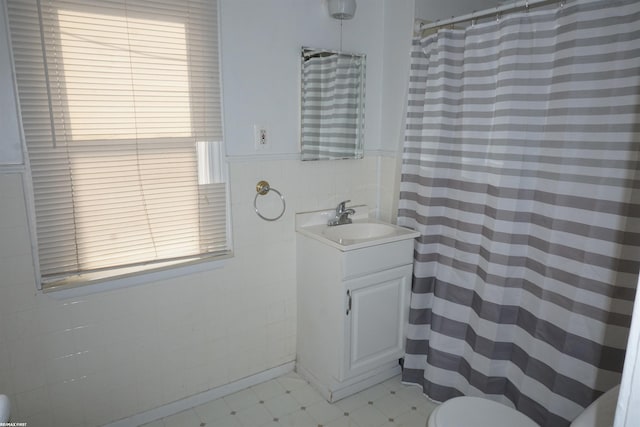 26333 Belanger St, Roseville, MI 48066 - bathroom featuring tile walls, vanity, toilet, and a shower with curtain