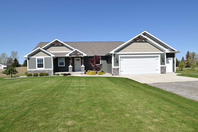 7272 S 7 Mile Rd, Freeland, MI 48623 - craftsman-style house with stone siding, driveway, and an attached garage