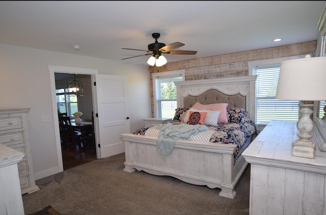 7272 S 7 Mile Rd, Freeland, MI 48623 - carpeted bedroom with a chandelier, ceiling fan, and baseboards